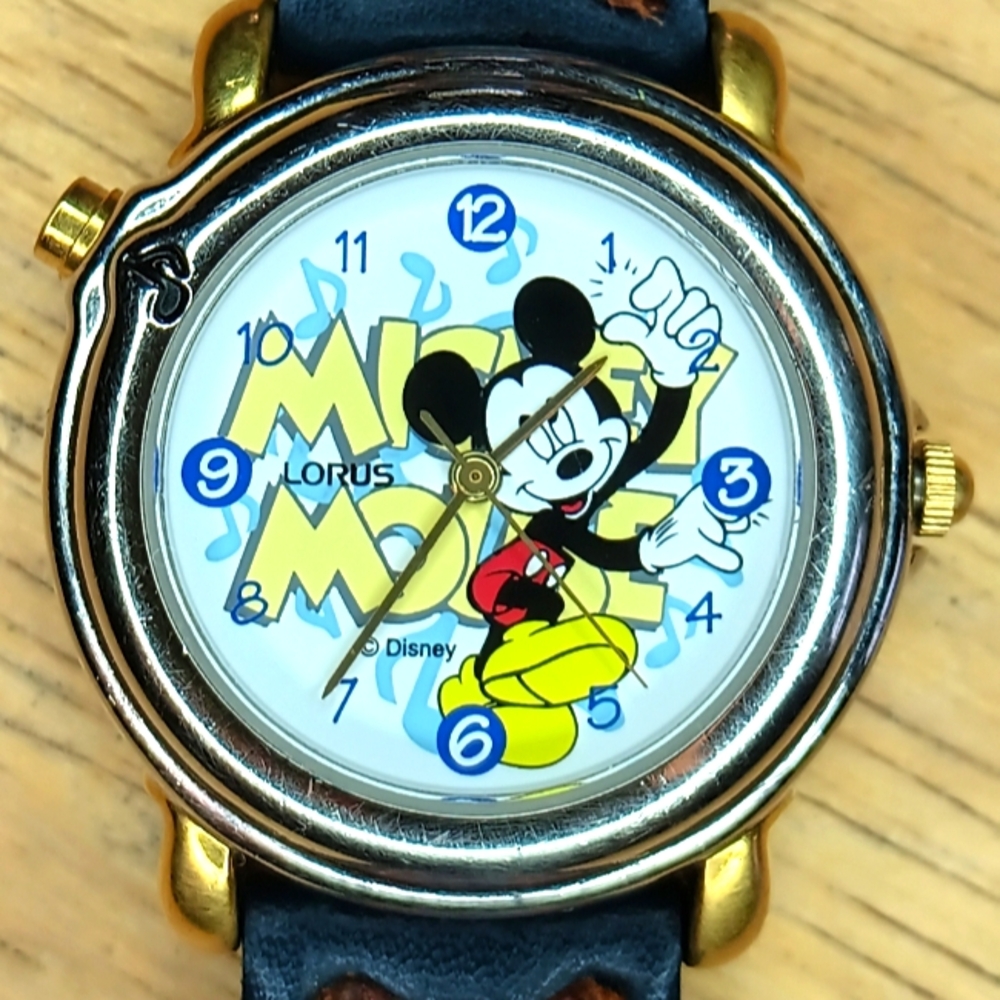 X Lorus Musical Mickey Mouse Silver case gold tone lugs and crown 3 hand